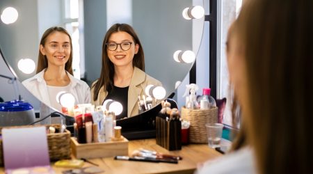 smiling-woman-and-makeup-artist