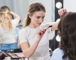 visagiste-doing-makeup-for-young-woman